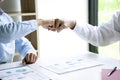 two business man use hand to fist bump for succes teamwork coporate Partner Business