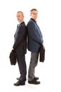 Two business men back to back with laptop bags Royalty Free Stock Photo