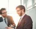 two business men discussing a business document. Royalty Free Stock Photo