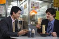 Two business men having lunch in Chinese restaurant