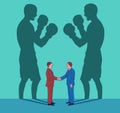 Two business men shake hands while their shadows fight like boxers Royalty Free Stock Photo