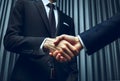 Two business men shaking hands, finishing up meeting. Successful businessmen handshaking after good deal. Royalty Free Stock Photo