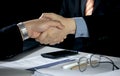 Two business men shaking hands after a job interview or agreement for cooperation. Royalty Free Stock Photo