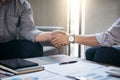 Two business men shaking hands during a meeting to sign agreement and become a business Royalty Free Stock Photo