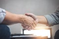 Two business men shaking hands during a meeting to sign agreement and become a business Royalty Free Stock Photo