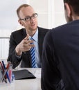 Two business men sitting in the office: meeting or job interview Royalty Free Stock Photo