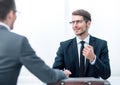 Two business men talking sitting at a Desk Royalty Free Stock Photo