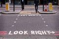 An advice in the pavement with two business men walking Royalty Free Stock Photo