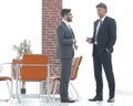 Two business executives talking about business in the office. Royalty Free Stock Photo