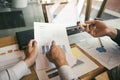 Two business partnership coworkers and gesturing with discussing a financial planning graph and company during a budget meeting in Royalty Free Stock Photo