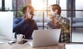 Two business people give high five in the office for motivation Royalty Free Stock Photo