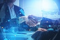 Two business people handshake over meeting desk. paper with pen Royalty Free Stock Photo