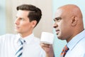 Two business people having informal coffee meeting Royalty Free Stock Photo