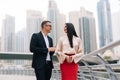 Two business people in an informal conversation in front of a business building Royalty Free Stock Photo