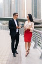 Two business people in an informal conversation in front of a business building Royalty Free Stock Photo