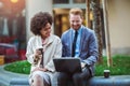 Two business people in an informal conversation in front of a business building Royalty Free Stock Photo