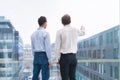 Two business people looking at horizon, projects, visions, collaboration, entrepreneurship Royalty Free Stock Photo