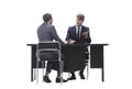 Two business people talking sitting at a Desk Royalty Free Stock Photo