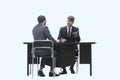 Two business people talking sitting at a Desk Royalty Free Stock Photo