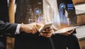 Business professionals analyzing financial data on mobile devices with digital charts and graphs representing market Royalty Free Stock Photo