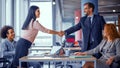 Two business teams successfully negotiating, shaking hands. Royalty Free Stock Photo