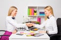 Two business women closing the deal with handshake Royalty Free Stock Photo