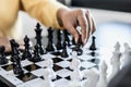 Two business women competitors playing chess board game, business competition concept, business plan to be the number one company Royalty Free Stock Photo