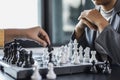 Two business women competitors playing chess board game, business competition concept, business plan to be the number one company Royalty Free Stock Photo