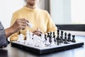 Two business women competitors playing chess board game, business competition concept, business plan to be the number one company Royalty Free Stock Photo