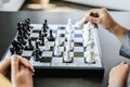 Two business women competitors playing chess board game, business competition concept, business plan to be the number one company Royalty Free Stock Photo