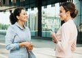 Two business women having a casual meeting or discussion in the city. Royalty Free Stock Photo