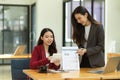 Two of business women presenting their strategy report papers on online conference meeting Royalty Free Stock Photo