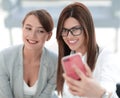 Two business women taking selfies in the office Royalty Free Stock Photo