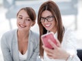 Two business women taking selfies in the office Royalty Free Stock Photo