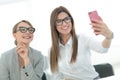 Two business women taking selfies in the office Royalty Free Stock Photo