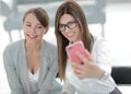 Two business women taking selfies in the office Royalty Free Stock Photo