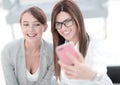 Two business women taking selfies in the office Royalty Free Stock Photo