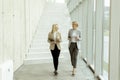 Business women walking in the office corridor Royalty Free Stock Photo