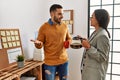 Two business workers relaxed drinking coffee at the office Royalty Free Stock Photo