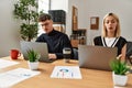 Two business workers working concentrated at the office