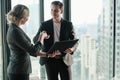 Two businessman and businesswoman couple meeting in co working space or office Royalty Free Stock Photo