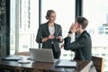 Two businessman and businesswoman couple meeting in co working space at sky lounge Royalty Free Stock Photo