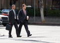 Two Businessman Chatting Whilst Crossing Street Royalty Free Stock Photo