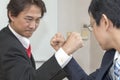 Two Businessman Competing In Arm Wrestling