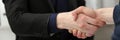 Two businessman shake hands as hello in office closeup Royalty Free Stock Photo