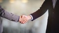 Two of businessman shaking hands as a symbol of unity, success, dealing, greeting and partner
