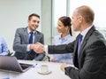 Two businessman shaking hands in office Royalty Free Stock Photo