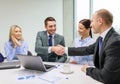 Two businessman shaking hands in office Royalty Free Stock Photo