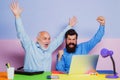 Two businessman sitting at the table typing on laptop computer working with new business plan. Two businessmen in an Royalty Free Stock Photo