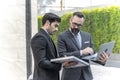 Businessman talking and checking quality power solar cell with laptop computor on site new project power solution business Royalty Free Stock Photo